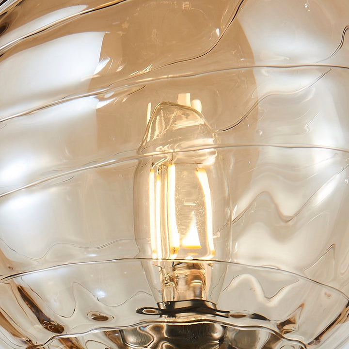 Gem Collection 1-Light Sconce with Amber Glass Black and Brushed Brass