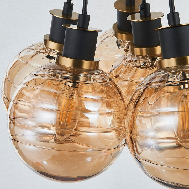 Gem Collection 7-Light Pendant with Amber Glass Black and Brushed Brass