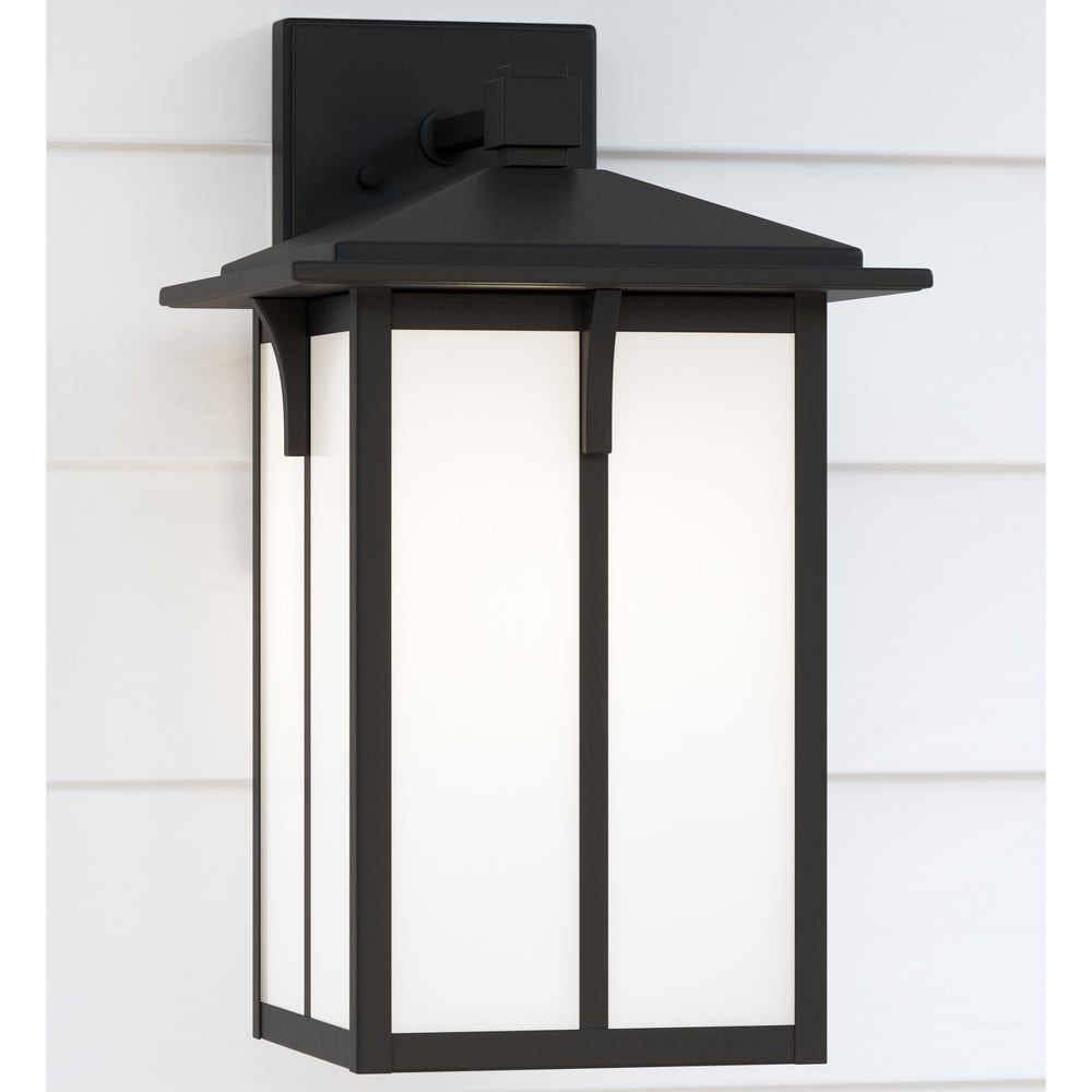 Tomek modern 1-light outdoor exterior medium wall lantern sconce in black finish with etched white g