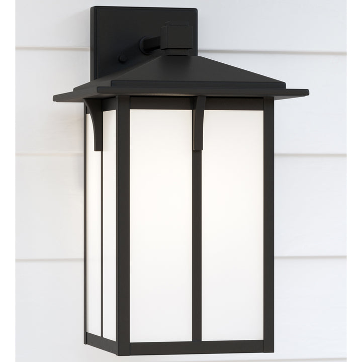 Tomek modern 1-light outdoor exterior medium wall lantern sconce in black finish with etched white g