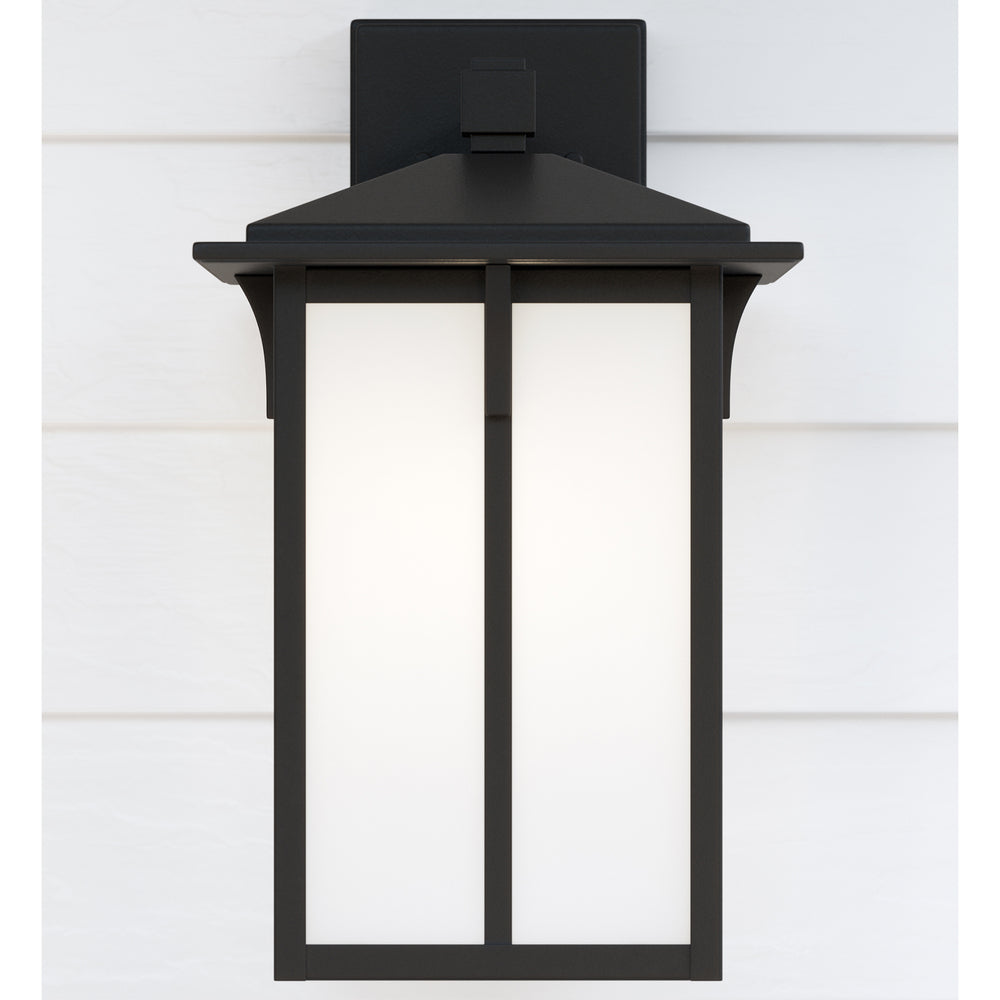 Tomek modern 1-light outdoor exterior medium wall lantern sconce in black finish with etched white g