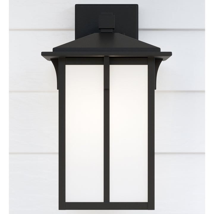 Tomek modern 1-light outdoor exterior medium wall lantern sconce in black finish with etched white g
