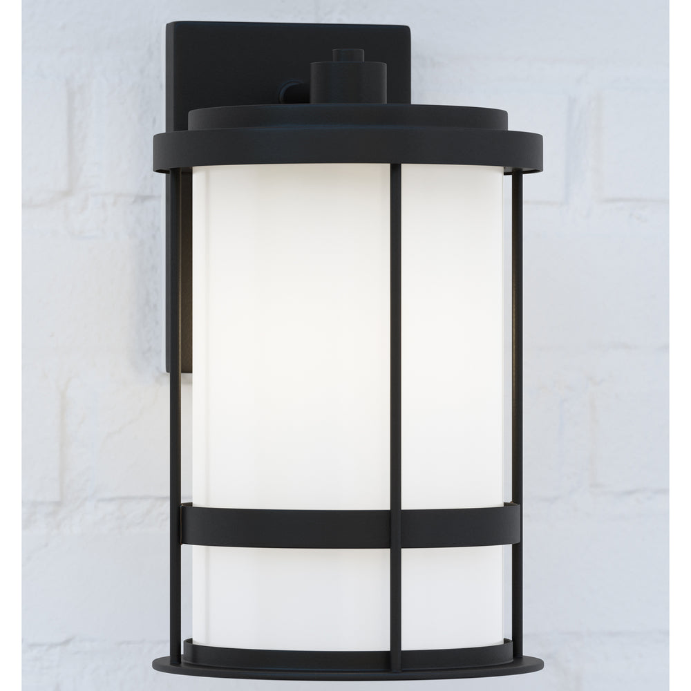 Wilburn modern 1-light outdoor exterior medium wall lantern sconce in black finish with satin etched