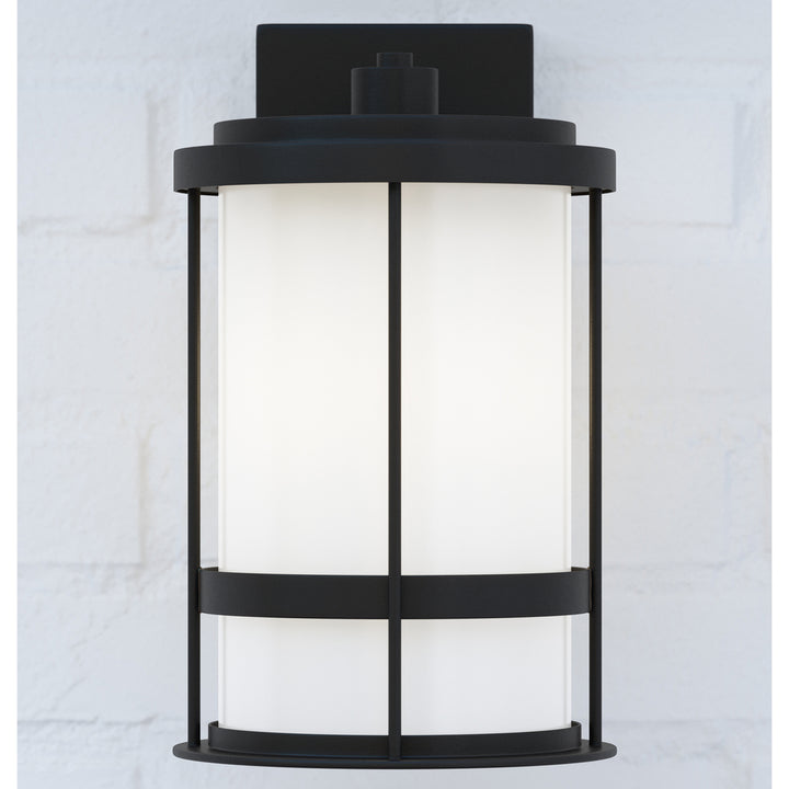 Wilburn modern 1-light outdoor exterior medium wall lantern sconce in black finish with satin etched